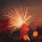 glowing fireworks illuminate the dark night sky generated by ai
